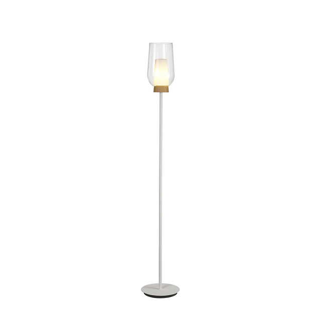The Nora 1 Light Clear Glass Floor Lamp features a slim white stand, round base, and clear glass shade with a wooden accent. The glowing bulb adds Scandinavian style to any space. Shown on a plain white background.