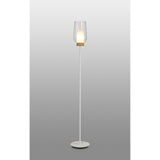 The Nora 1 Light Clear Glass Floor Lamp in white features a circular base, slender pole, wood-accented clear glass shade, and emits gentle Scandinavian light against a gray gradient backdrop.