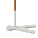 The image displays the lower part of the Nordica 1 Light Floor Lamp in matt white with an ivory white shade, featuring a wooden pole and a three-pronged base, all set against a plain white background.