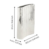 Nosimaro Vase 22cm in nickel-finish aluminium, a slim flat vase with ribbed front, smooth polished edges and a wavy top opening, shown with dimension labels on a white background.