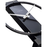 Close-up of the Open Ring Wood and Steel Table or Wall Clock 34cm in black, showing the round open frame with white baton markers and white hands on a central black column.