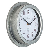 Poppy round wall clock, 22cm, with deep galvanised silver case and white dial featuring bold black numerals and slim hands, shown at an angle on a plain background.