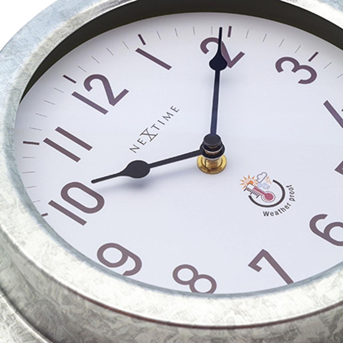 Close-up of the Poppy round wall clock showing the white dial with bold numerals, slim black hands, and deep galvanised silver case.