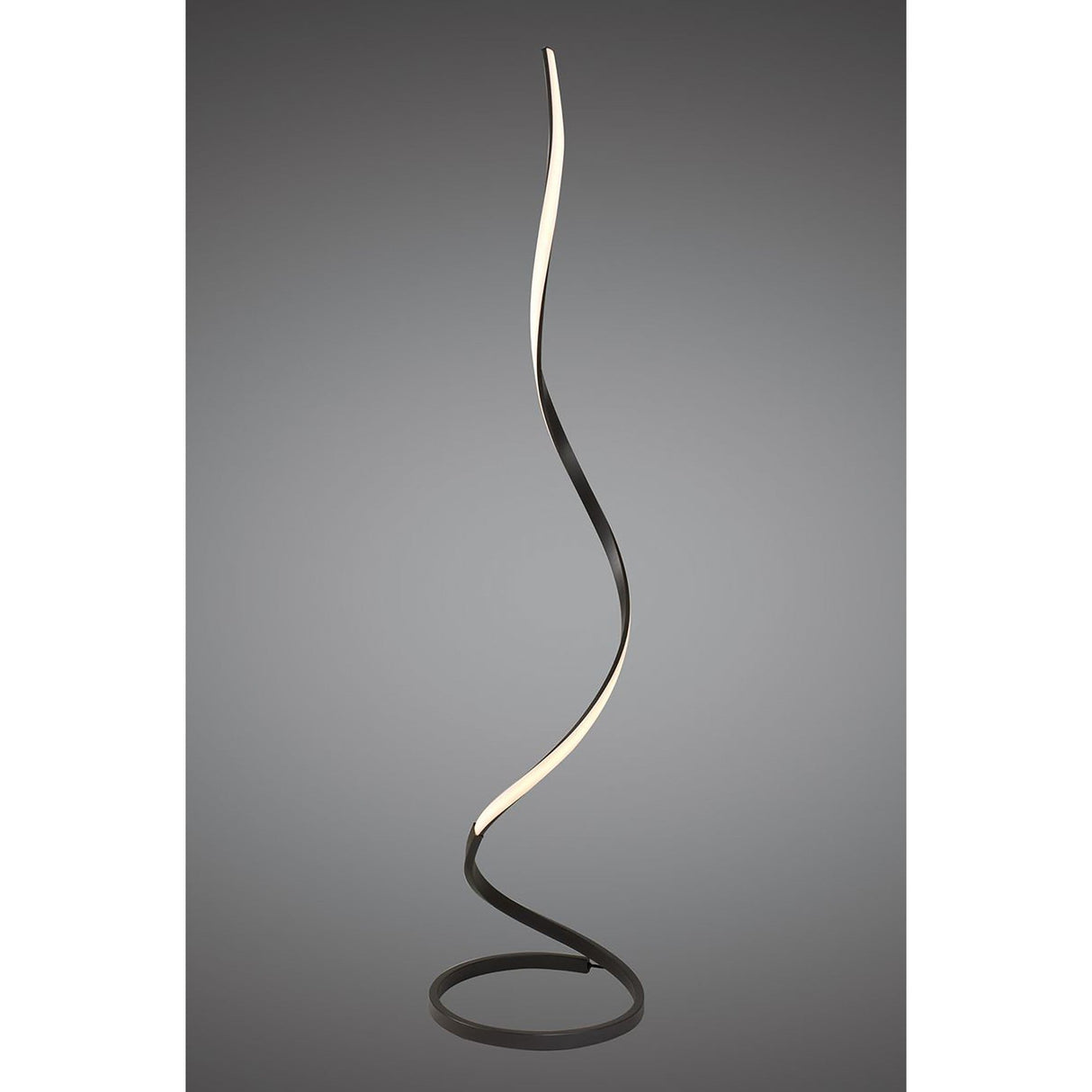 The Nur Dimmable LED Floor Lamp 20W 2800K in Brown Oxide features a sleek, twisting ribbon design on a circular base with an illuminated inner edge, adding modern lighting style to any space.