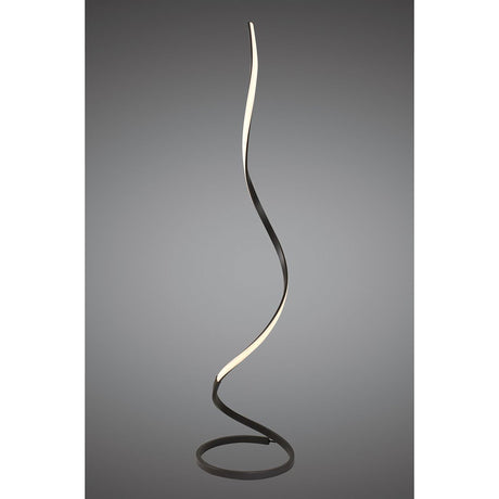 The Nur Dimmable LED Floor Lamp 20W 2800K in Brown Oxide features a sleek, twisting ribbon design on a circular base with an illuminated inner edge, adding modern lighting style to any space.