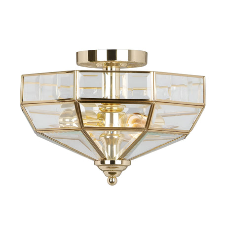 The Old Park 2 Light Semi Flush - Polished Brass is a modern, geometric ceiling fixture crafted from polished brass and glass panels, featuring two visible bulbs. Its angular shape resembles a faceted gem, adding a sophisticated touch to any room with its warm metallic glow.