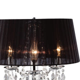 The Olivia 3 Light Crystal Table Lamp features a polished chrome base, black pleated shade, illuminated bulbs, and sparkling crystal accents for an elegant look.