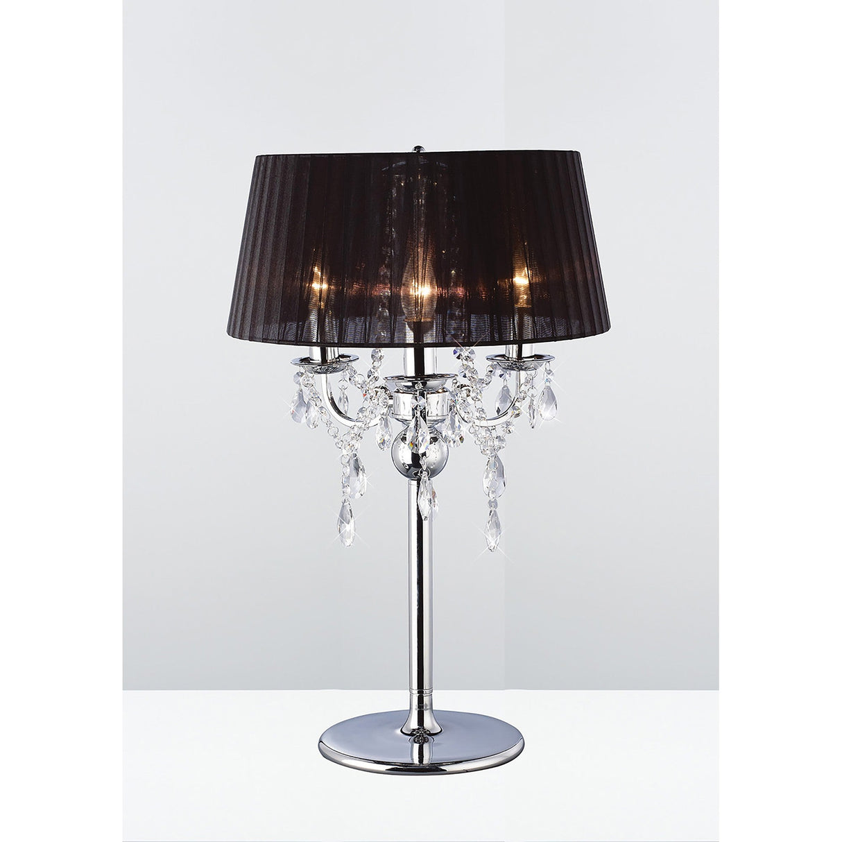 The Olivia 3 Light Crystal Table Lamp features a polished chrome finish, black shade, and elegant crystal accents beneath each bulb for a refined, modern look.