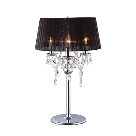 The Olivia 3 Light Crystal Table Lamp features a polished chrome finish, black shade, ornate arms, hanging crystal accents, and pleated design for a warm, inviting glow.