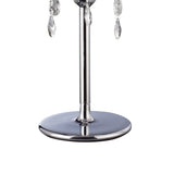A close-up of the Olivia 3 Light Crystal Table Lamp in chrome, featuring a slender pole, dangling crystal accents, and an ivory cream shade, set against a white background.