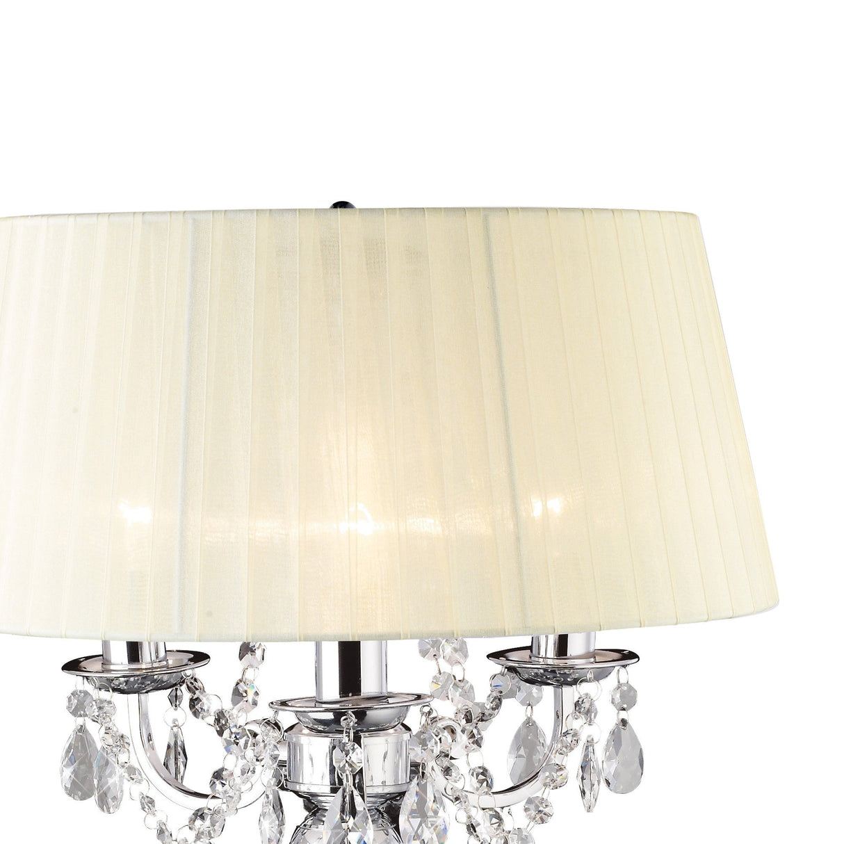 The Olivia 3 Light Crystal Table Lamp features a polished chrome base with crystal ornaments, candle-style light holders, and an ivory cream shade for a sophisticated look.