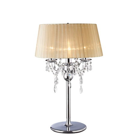 The Olivia 3 Light Crystal Table Lamp features a polished chrome base, hanging crystal accents from ornate arms, and a soft bronze pleated shade, displayed against a white background.