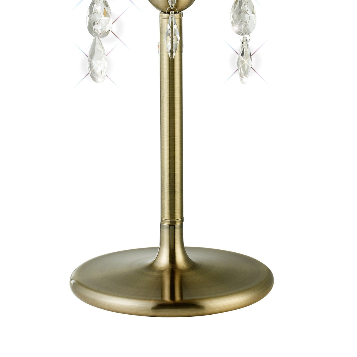 A close-up of the Olivia 3 Light Crystal Table Lamp in antique brass, featuring a smooth, round base and sparkling crystal pendants, shown against a white background with its elegant black shade.