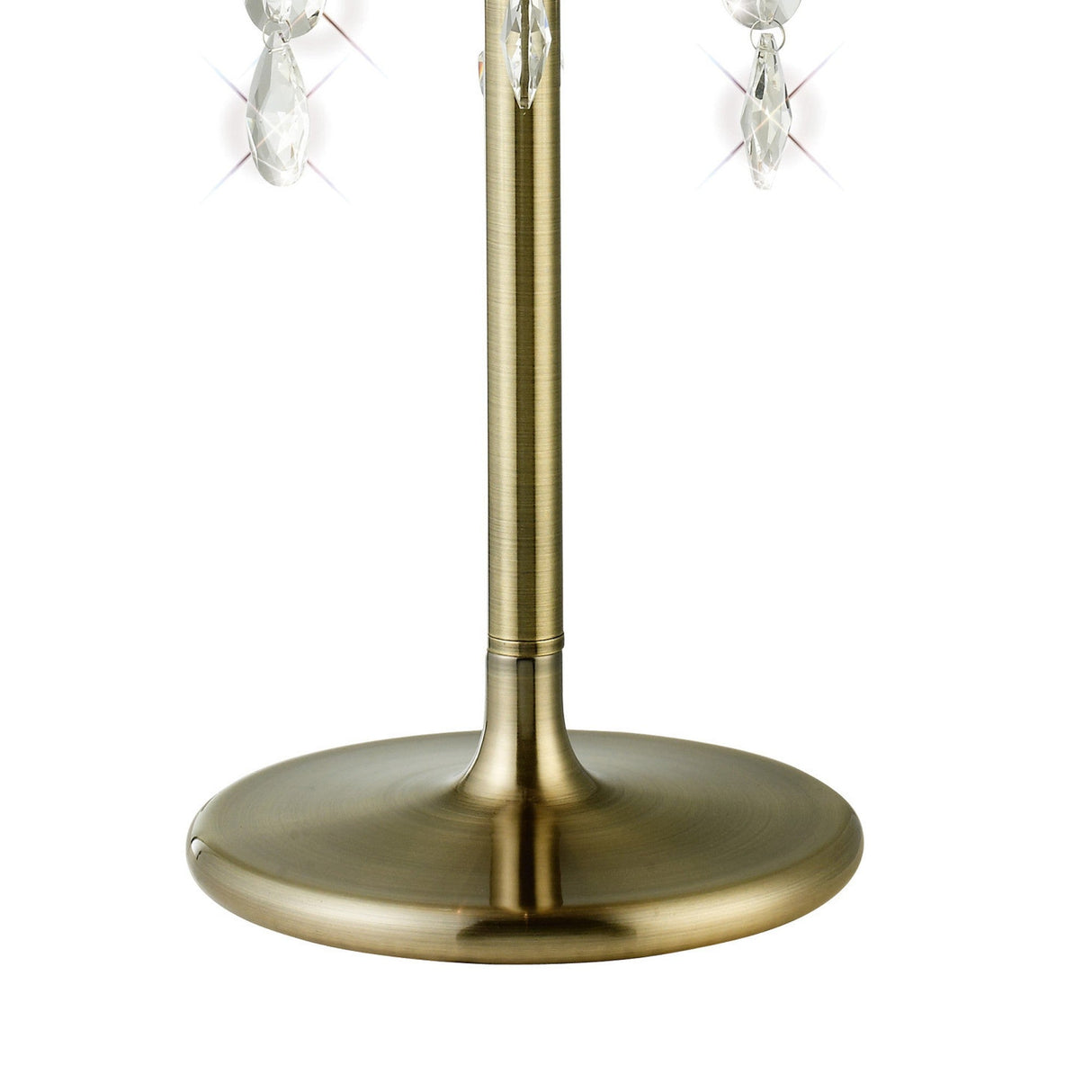 Close-up of the Olivia 3 Light Crystal Table Lamp in antique brass with a smooth, round base, slender pole, bronze shade, and hanging crystal ornaments that add subtle sparkle to this elegant design.