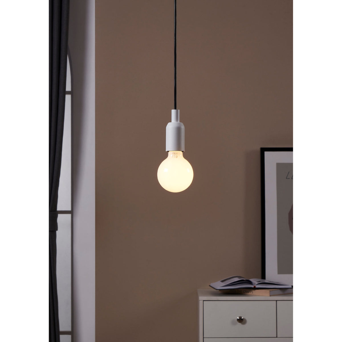 Pendant light fitted with an Opal LED globe bulb E27 G80, glowing warm white above a white chest of drawers in a neutral-toned room.