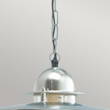 A close-up of the Oslo Outdoor 1 Light Chain Pendant in silver showcases its sleek, dome-shaped top and suspension chain. Made from galvanized steel, it boasts a shiny, reflective finish that captures the essence of Scandinavian design simplicity, set against a plain background.