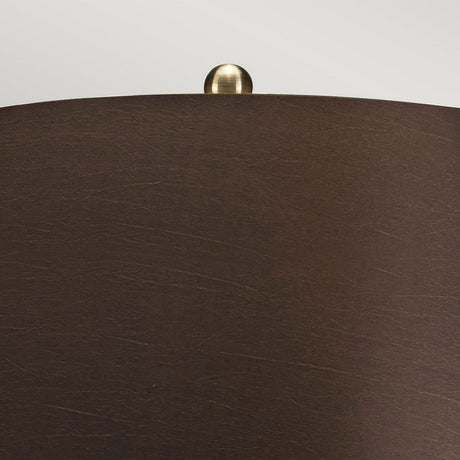 Close-up of the Ottoman 1 Light Table Lamp, showcasing its bronze metallic finish with a smooth brass knob at the top center against a plain light gray background.