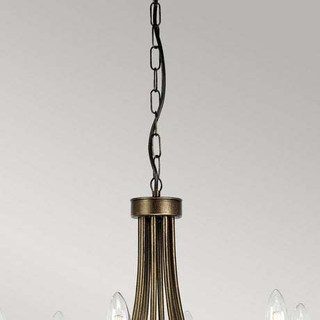 The Olivia 8 Light Chandelier in Black/Gold Patina elegantly hangs from a ceiling chain with its gracefully curved metal arms. With candle-style light bulbs, it adds a classic touch of sophistication to a plain white background.