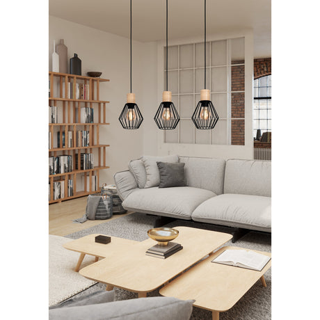 Palmorla Linear Pendant Light featuring three black wire cage shades with light wood lamp holders on a black ceiling bar, shown above a sofa and coffee table in a living room.