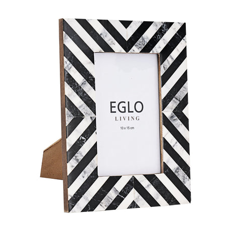 Panaon Photo Frame with black and white chevron-patterned polyresin border and marbled finish, holding a 10x15cm picture behind glass, shown on a plain white background.