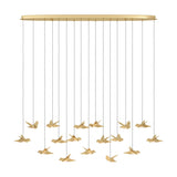 Paratebueno 2 linear pendant light with an oval brass canopy and seventeen bird-shaped shades hanging at varying heights, shown on a plain white background.