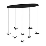 Paratebueno 8 Light Linear Pendant in black, an oval ceiling plate with eight cords suspending bird-shaped LED shades at varying heights on a plain white background.