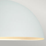 Close-up of the Paris Outdoor Large 1 Light Wall Lantern in white, featuring a minimalist dome shape with a smooth surface. The softly glowing light produces a subtle gradient against a light gray background, epitomizing modern outdoor lighting elegance.