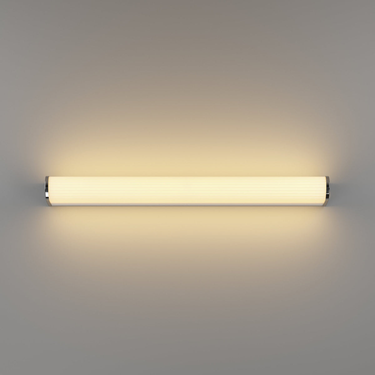 Patrovaro LED bathroom mirror light, 60cm, a slim fluted white shade with chrome end caps and aluminium body, glowing warm white on a plain grey background.