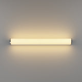 Patrovaro LED bathroom mirror light, 60cm, a slim fluted white shade with chrome end caps and aluminium body, glowing warm white on a plain grey background.