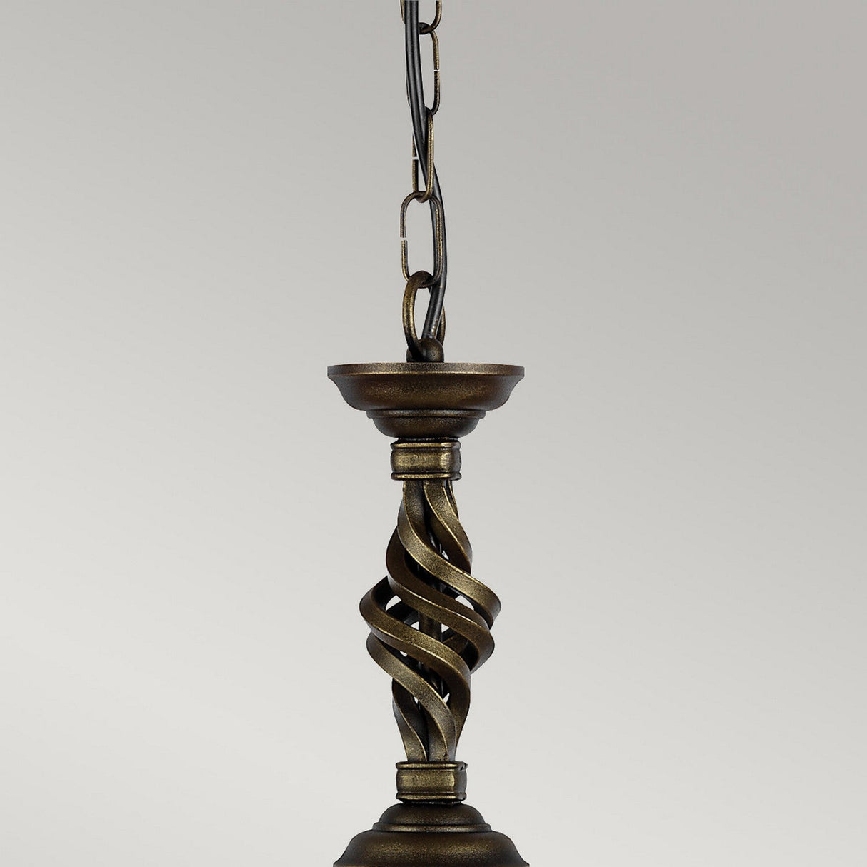 The Pembroke 1 Light Pendant in a black and gold finish, featuring a hand-forged iron design with twisted ornaments, hangs elegantly from a chain against a plain background.