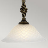 Introducing the Pembroke 1 Light Pendant in Black/Gold, featuring a frosted glass lampshade with a diamond pattern. The hand-forged iron fixture above showcases a dark finish with a twisted, spiral design. This pendant casts a soft glow that beautifully highlights its intricate details.