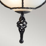 A close-up of the Pembroke Wall Light in black displays an intricate, twisted design reminiscent of semi-flush elegance. Set against a neutral gray background, it highlights the craftsmanship and high-quality fittings inherent in such elegant pieces.