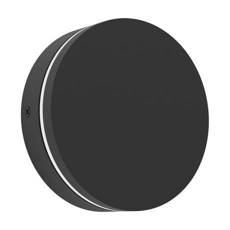 Pedersano Round LED Outdoor Wall Light in black, a flat circular aluminium and plastic disc with a thin edge light strip, shown at an angle on a plain white background.