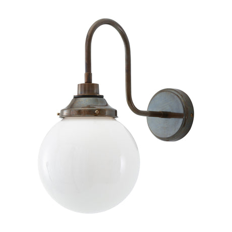 Pelagia Glass Swan Neck Globe Wall Light IP44 in aged brass finish with a round opal glass globe shade, shown on a plain white background.