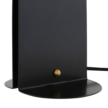 Close-up of the Pencil Brass Dome Table Lamp's matt black base and body, showing the folded metal panel and round brass switch against a white background.