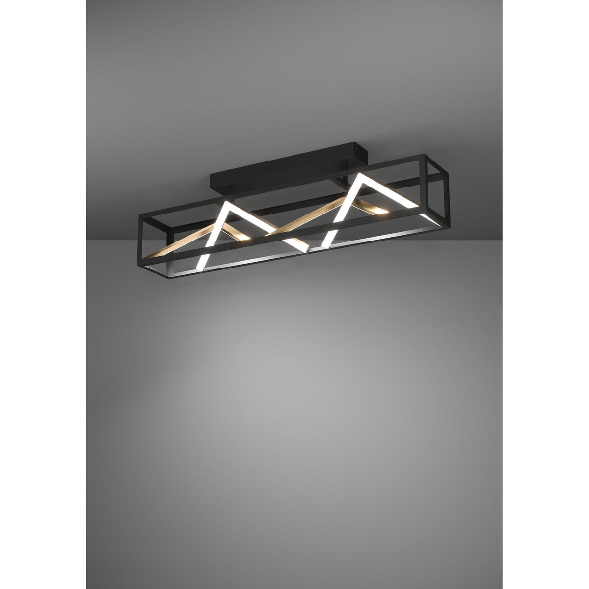 Penela LED Ceiling Light in black with a long open rectangular frame, zigzag white LED strips and gold-coloured bars, shown illuminated against a grey background.