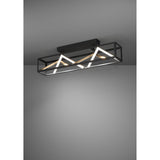 Penela LED Ceiling Light in black with a long open rectangular frame, zigzag white LED strips and gold-coloured bars, shown illuminated against a grey background.