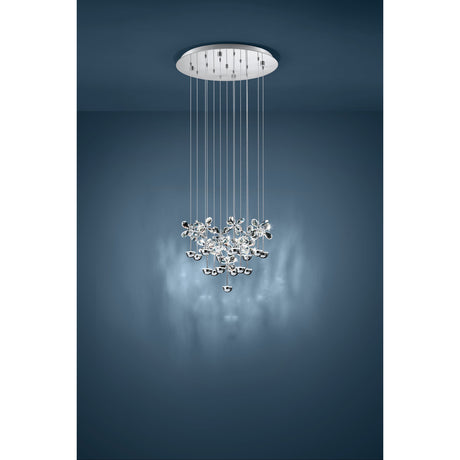 Pianopoli multi-light pendant with round chrome ceiling plate and fifteen suspended clear glass flower clusters, shown hanging in a dark blue-toned room.