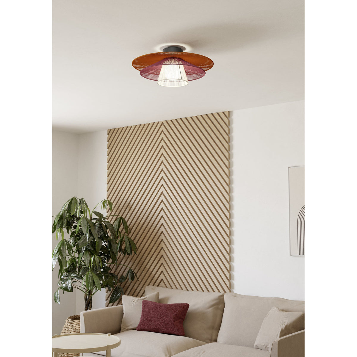 Pignona Ceiling Light in black mounted flush on a living room ceiling, with tiered woven textile shades in orange, red, and cream around a central bulb.