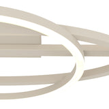 Close-up of the Planillo LED flush ceiling light in sand, showing crossing aluminium and steel rings and a straight bar with a glowing white plastic diffuser, against a plain white background.