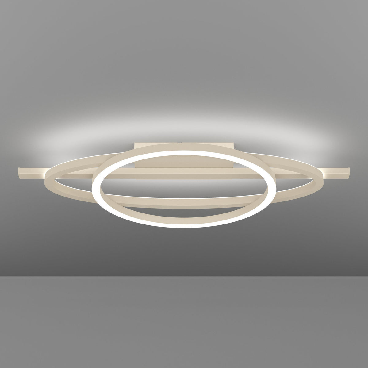 Planillo LED Flush Ceiling Light in Sand, featuring a circular ring, elliptical ring and straight bar in sand aluminium and steel, mounted on a rectangular ceiling plate against a grey background.