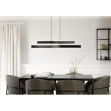 Playitas Pendant Light in brushed aluminium and black, two slim LED bars hung at staggered heights above a dining table in a neutral dining room setting.