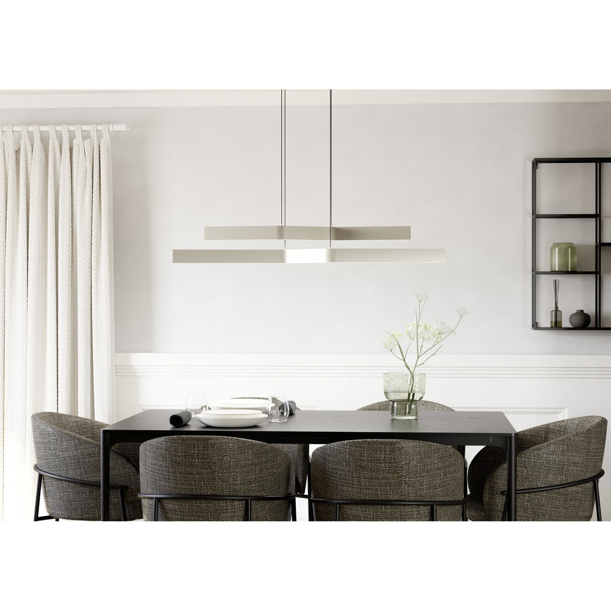 Playitas Pendant Light in satin nickel, two slim parallel steel bars with integrated LED, hung on fine wires above a black dining table in a neutral-toned dining room.