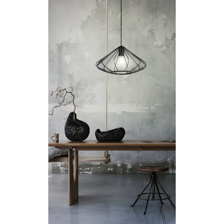 Polmorne Fabric Pendant Light 42.5cm in Black, a single-bulb cone-shaped mesh shade on a black cord, shown above a wooden dining table in a neutral grey room.