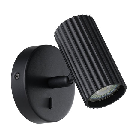 Portillo Wall Light in matt black aluminium and steel, with a round backplate, short pivoting arm, and fluted cylindrical head for a single GU10 bulb, shown on a white background.