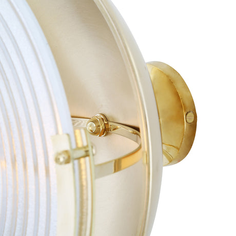 Close-up of the Portland Ribbed Glass Wall Light showing the brass frame, domed housing, curved arm, and round wall plate against a white background.