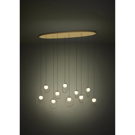 Portocolom Glass 10 Light Linear Pendant Light in brass and gold, with opal glass globes in slim gold rings hanging at varied heights from a long oval canopy.
