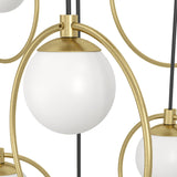 Close-up of the Portocolom 10-light pendant showing a matt opal glass globe in a gold ring bracket, with brass fittings and black cords against a white background.