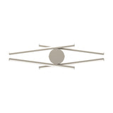 Pradilla LED flush ceiling light in sand, four slim aluminium and steel bars crossing in an X with white plastic diffusers around a round canopy, shown on a plain white background.