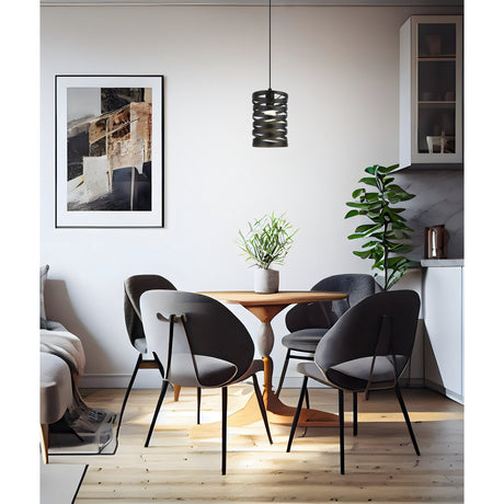 Pranvorne Pendant Light 18cm in black steel with a spiralled cylindrical shade, hung above a wooden dining table in a living and dining space.